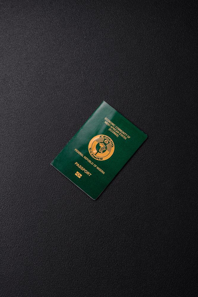 Nigerian passport featuring the ECOWAS emblem, symbolizing international travel documentation and passport services.
